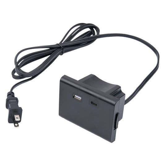 Black electronic device with USB ports and power cord on a white background