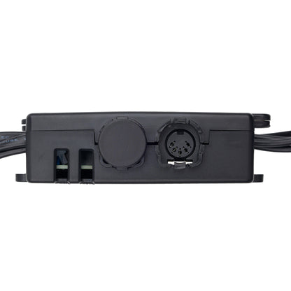 A close-up of a black electronic control module with various connectors and ports, shown against a plain white background.