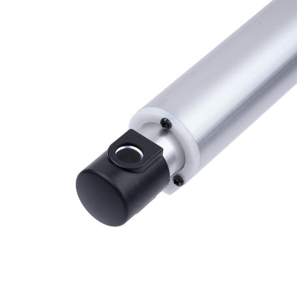Close-up of a cylindrical metal component with a black fitting on a white background