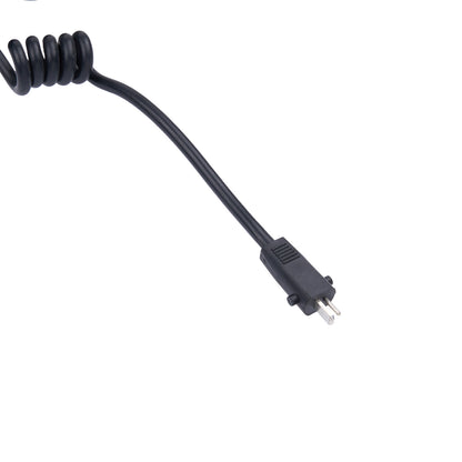 Black coiled cable with a plug on a white background