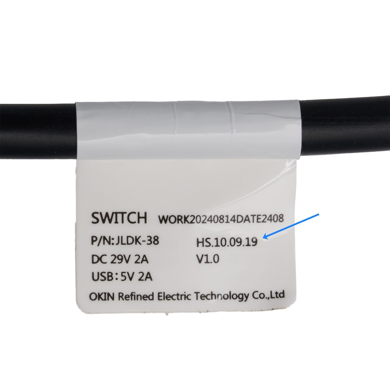 Label on a black cable with technical specifications and branding