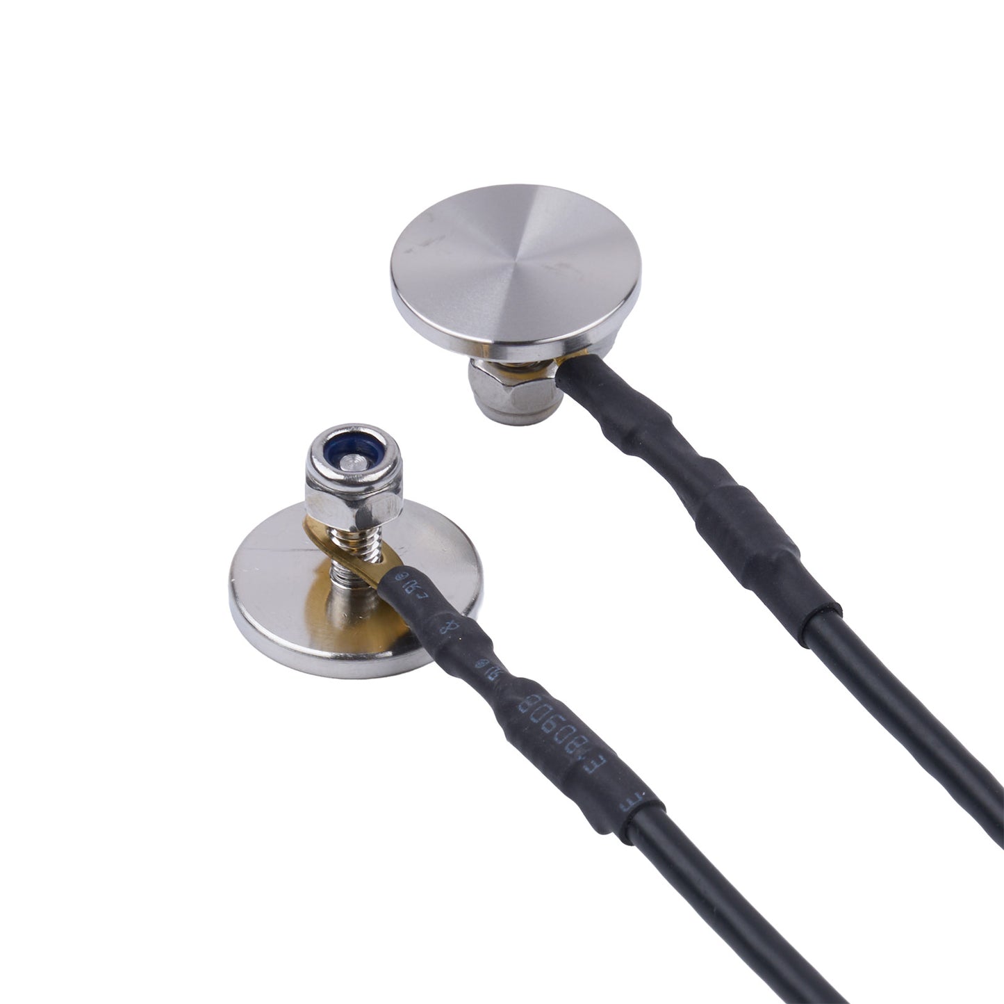 Close-up of a metal device with a black cable on a white background