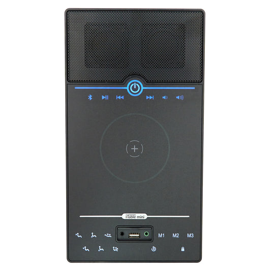 A black portable Bluetooth speaker with an integrated wireless charging pad and control buttons on the front, shown against a plain white background.